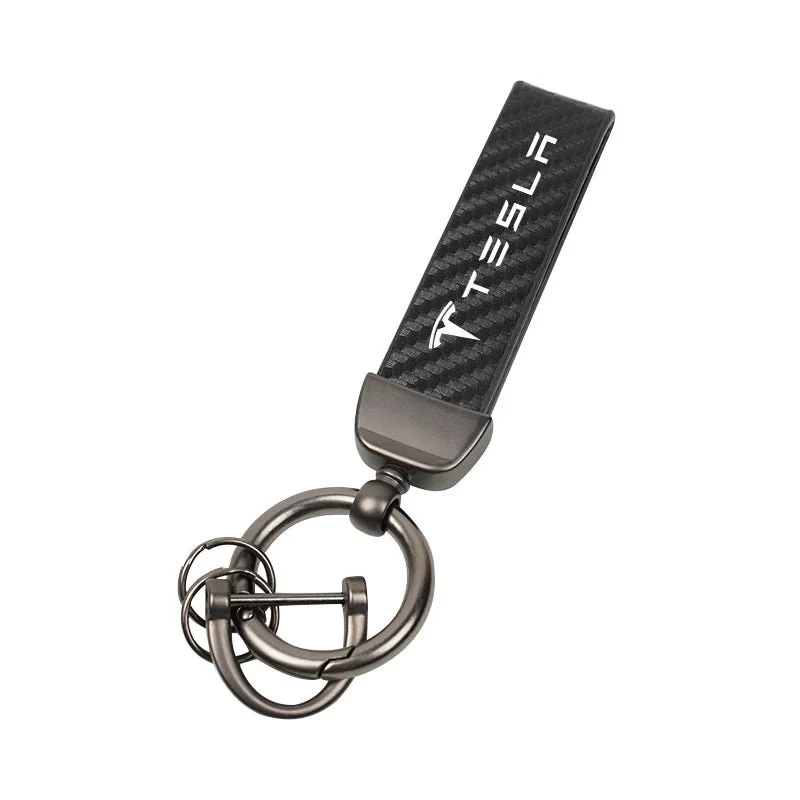 Schlüsselanhänger aus Wildleder mit roten Ziernähten und Tesla-Logo – Tesla-Geschenkserie
